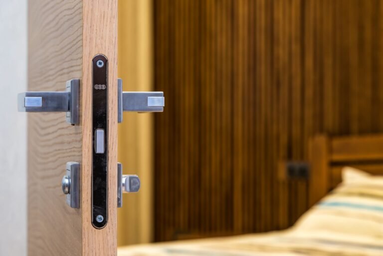 Close up of a door latch bolt and handle on a wooden interior door edge