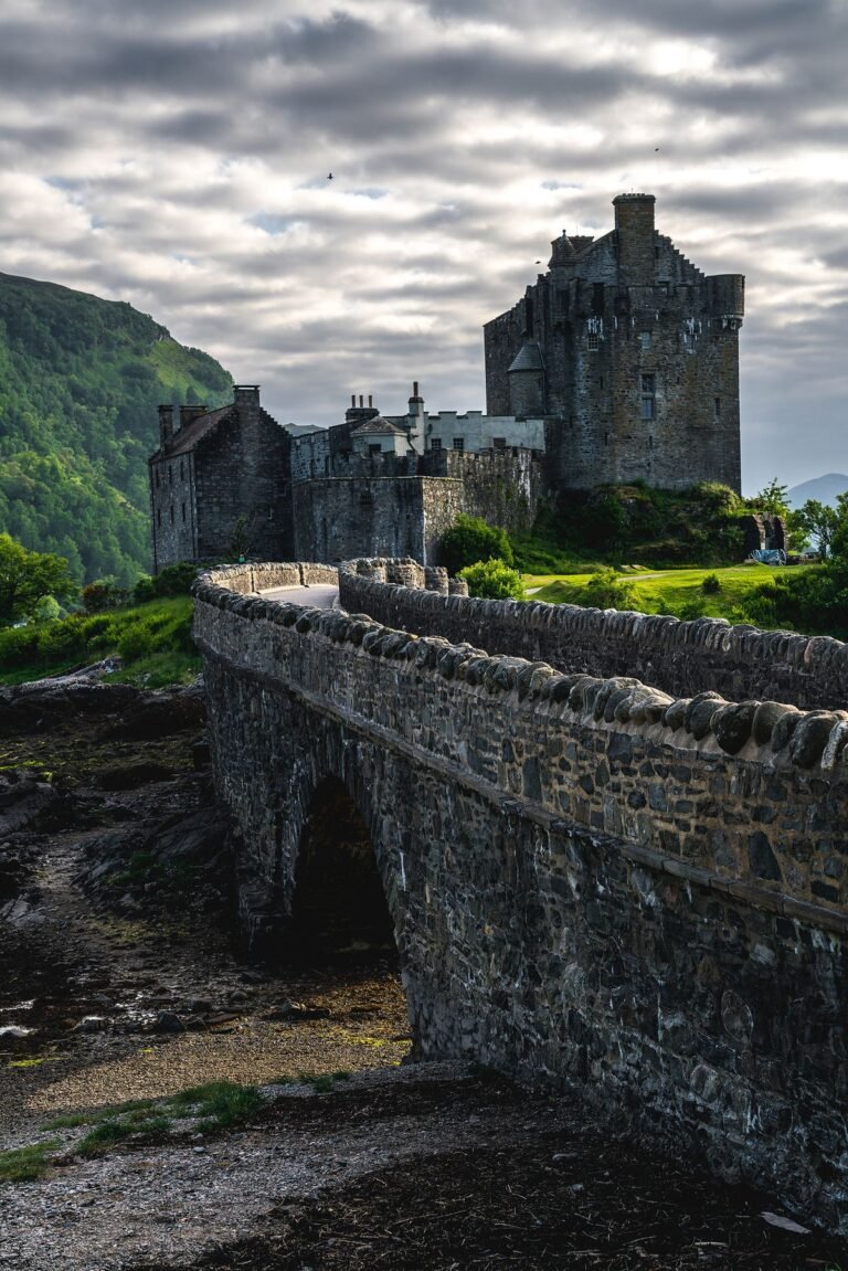 Eilean Donan Castle reflected in still water in the Scottish Highlands, the kind of dramatic setting where Celebrity Traitors series two unfolds