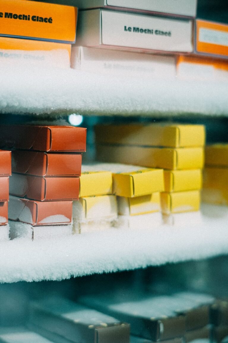 Freezer covered in thick frost and ice before defrosting.