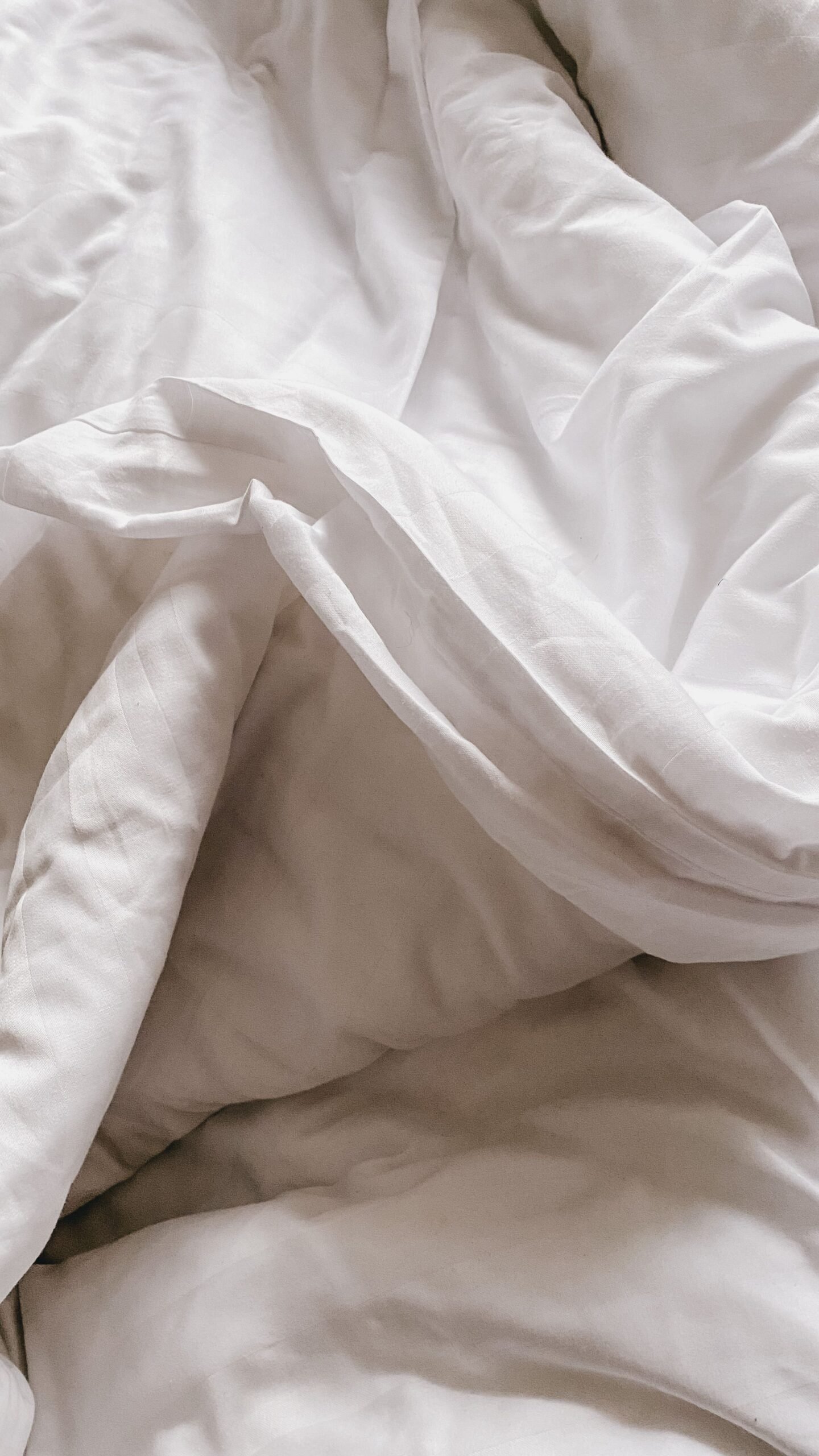 Close up of white cotton bed sheet fabric