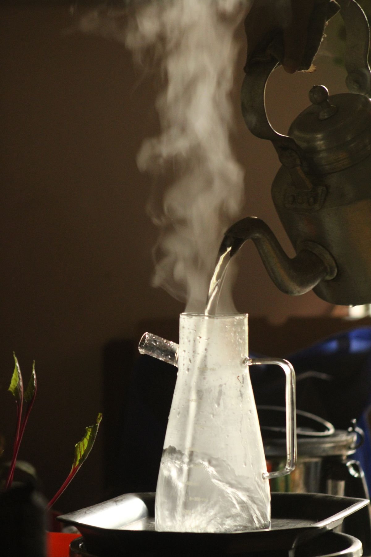 Steaming kettle of hot water used to defrost a freezer quickly