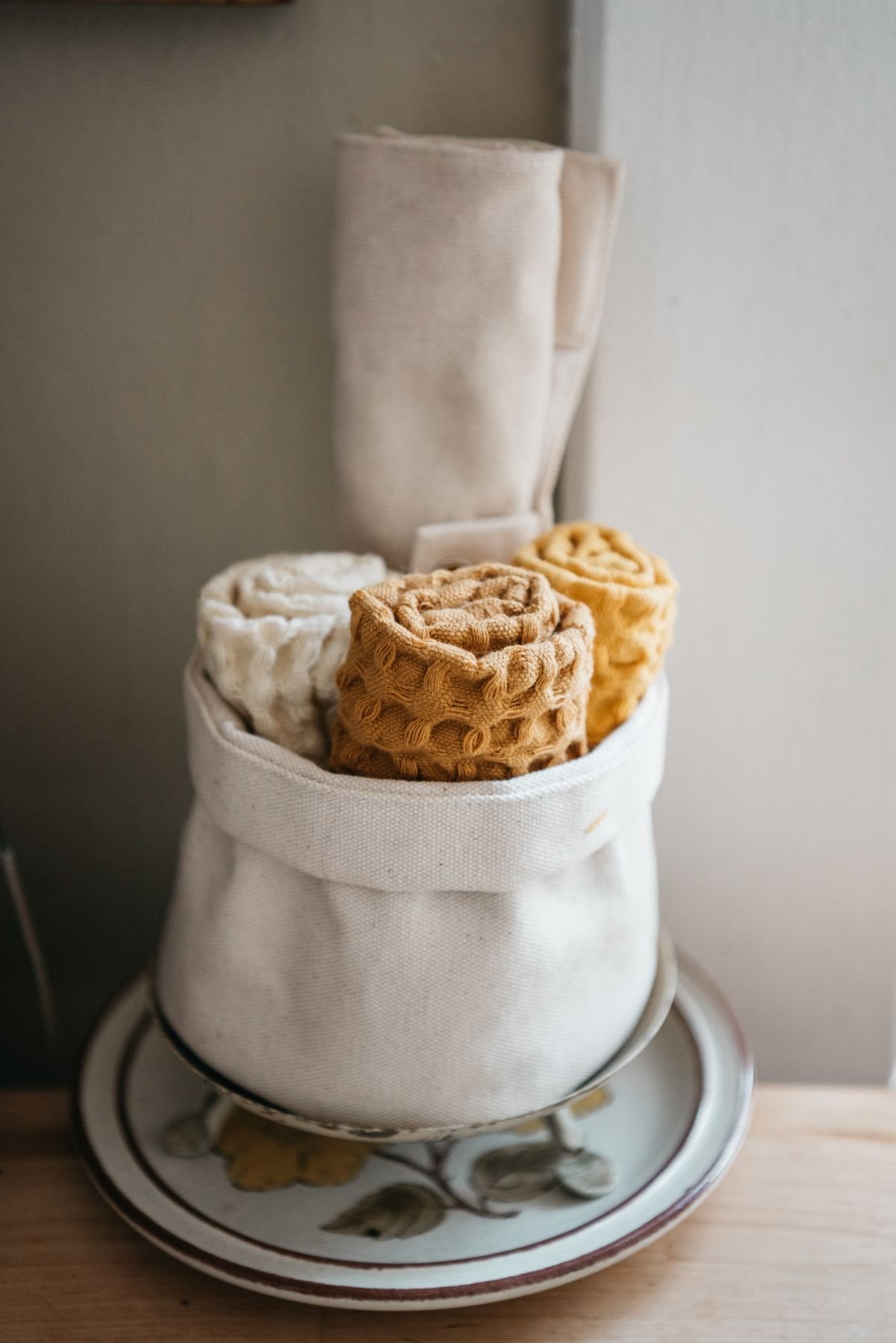 Stack of clean cotton kitchen towels for defrosting a freezer