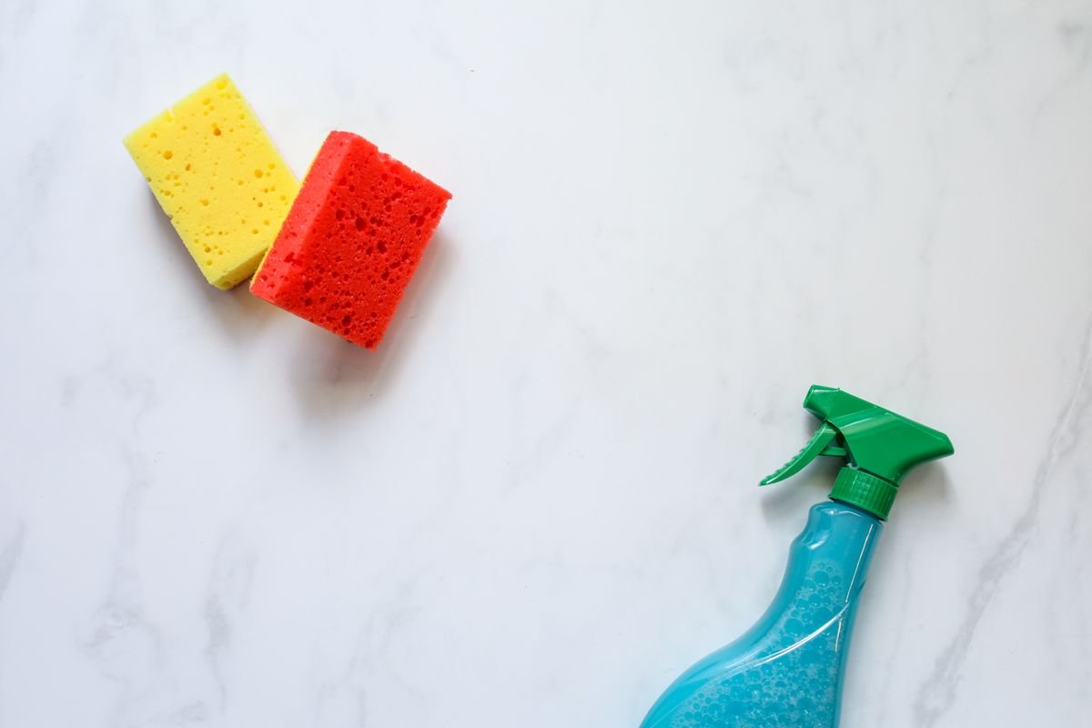 Cleaning sponges and spray bottle used to clean a dishwasher