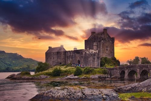 Eilean Donan Castle in the Scottish Highlands at sunset
